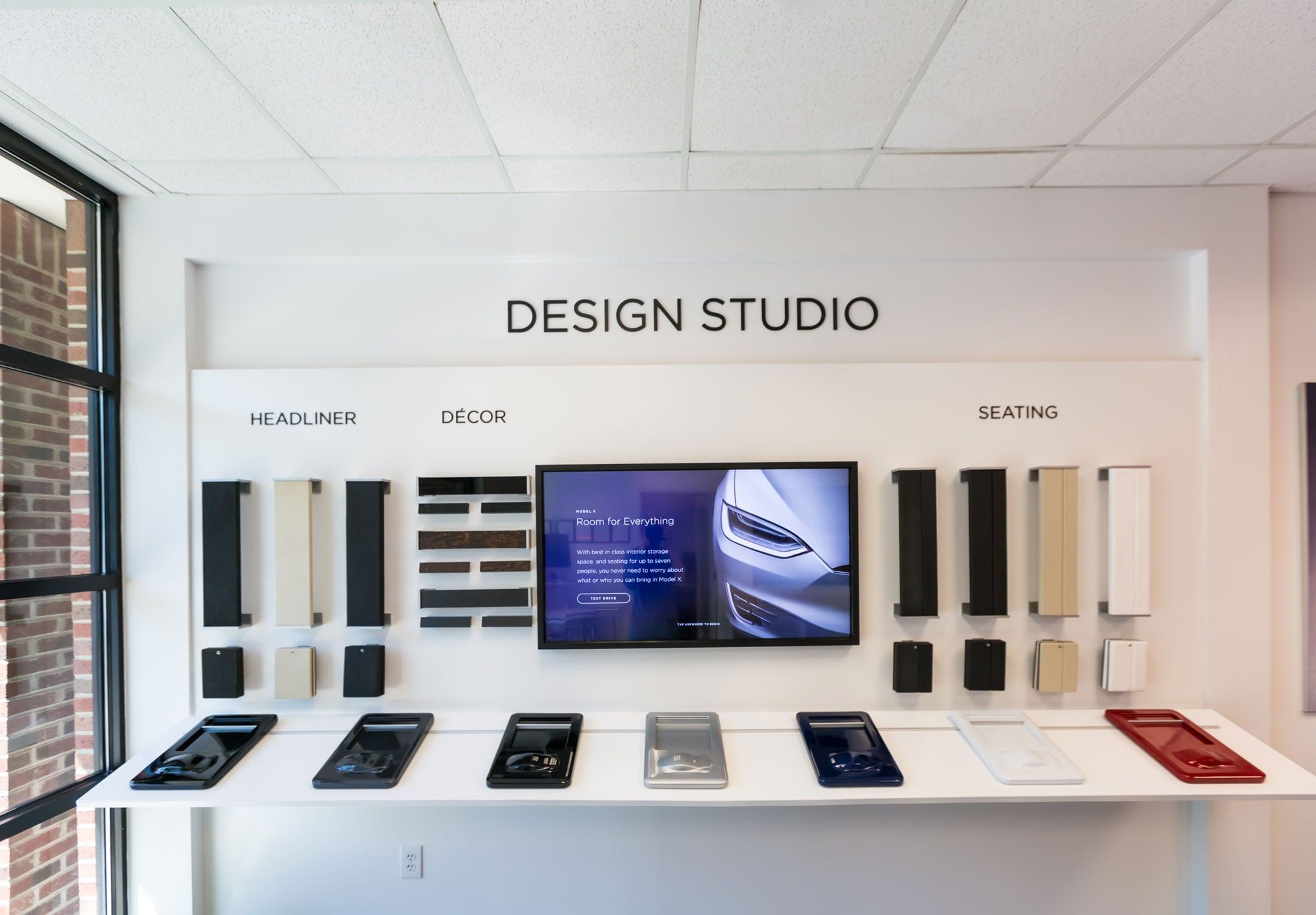 A design studio space with touch screens and devices on display