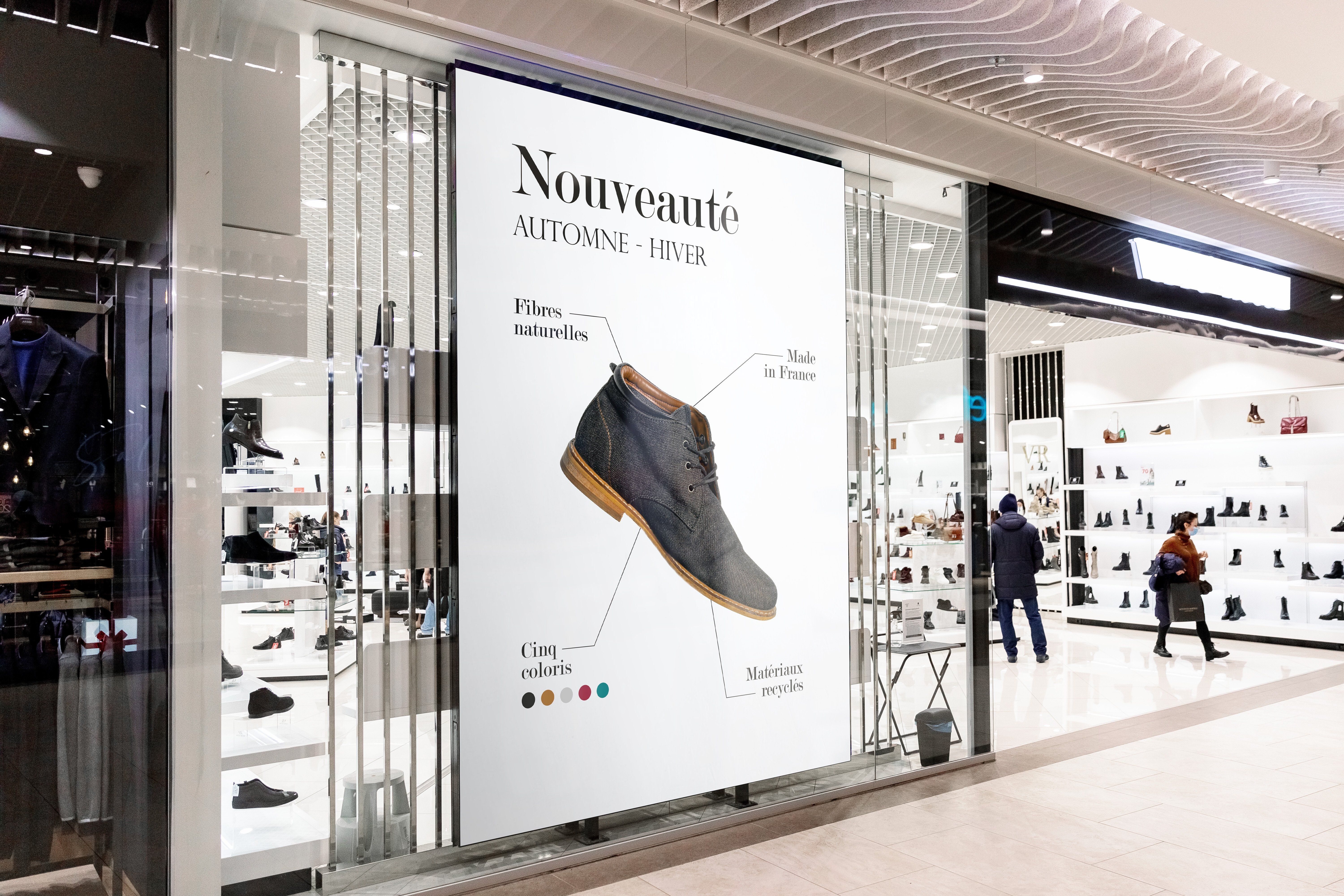 A digital display in a shoe store window