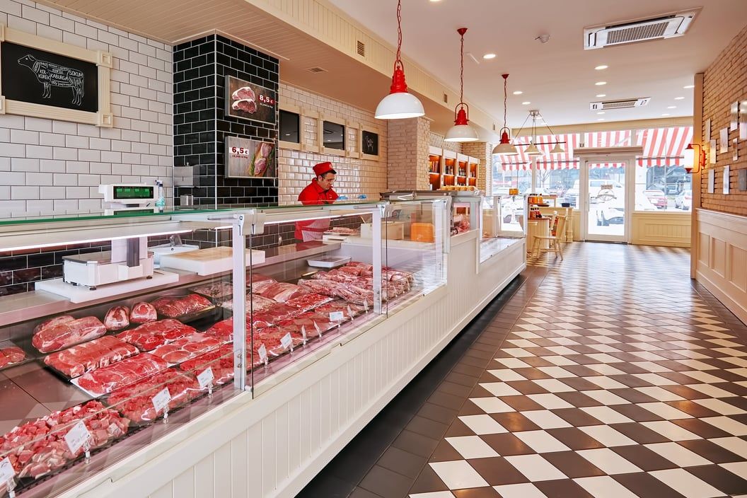Digital signage screens in a butcher shop